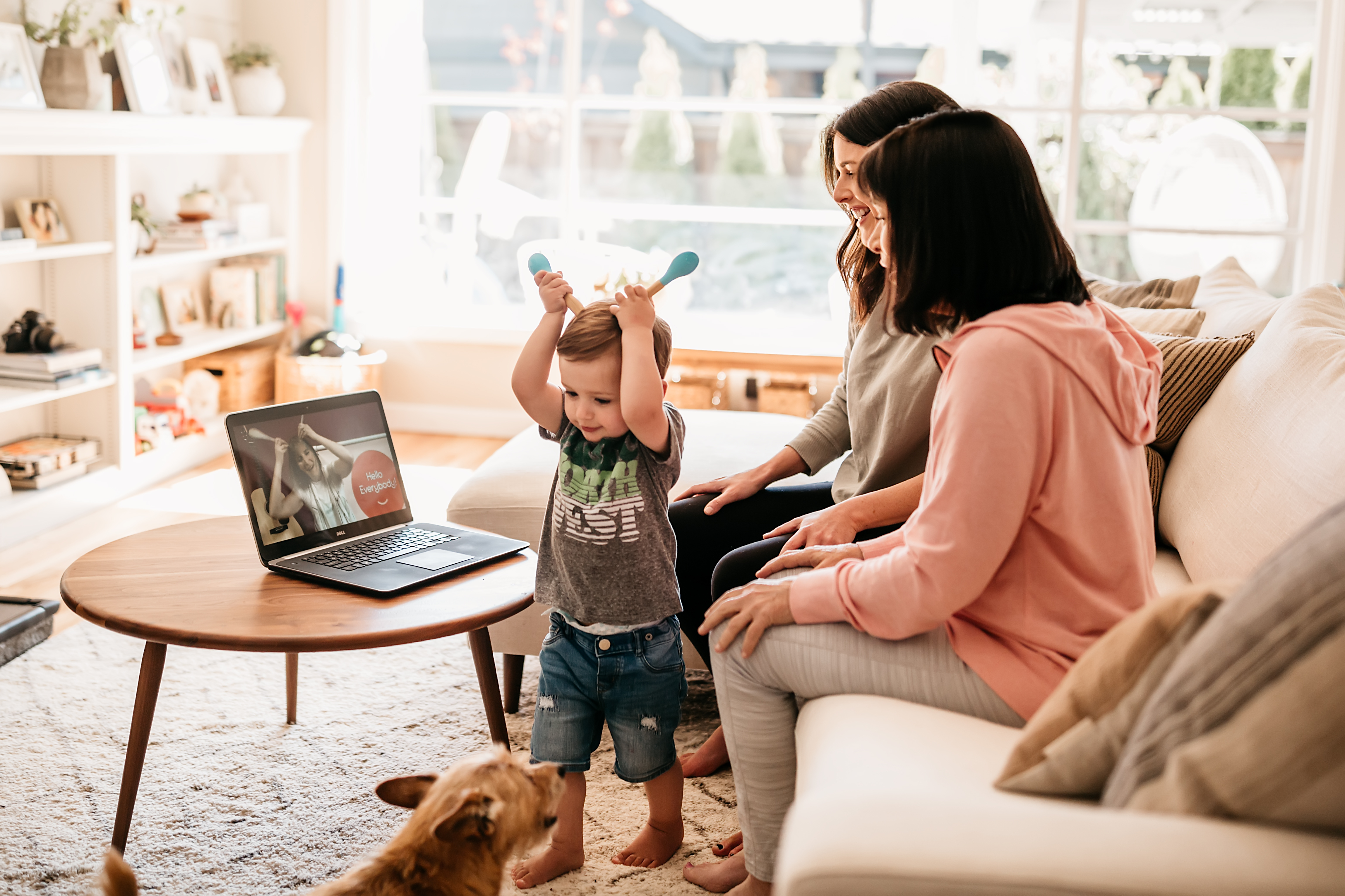 mother, son, and grandmother taking virtual online music class together at home